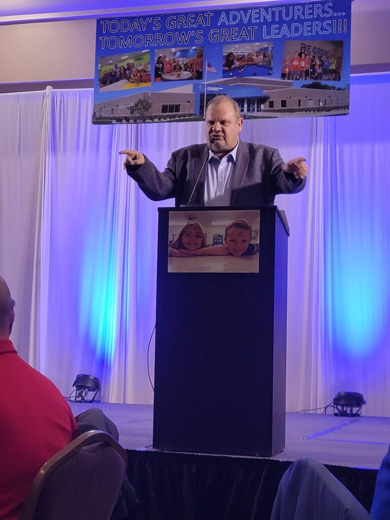 Speaker at a podium addressing a Boys and Girls Club banquet